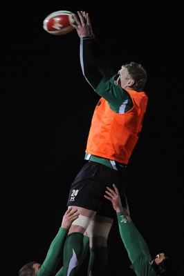 24.02.10 - Wales Rugby Training - Bradley Davies takes line-out ball during a night training session in preparation for Wales Friday night match against France. 
