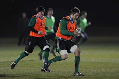 24.02.10 - Wales Rugby Training - Ryan Jones is supported by Martyn Williams during a night training session in preparation for Wales Friday night match against France. 
