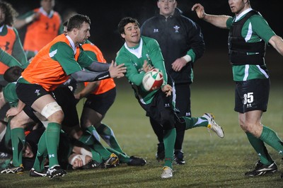 24.02.10 - Wales Rugby Training - Mike Phillips makes a pass during a night training session in preparation for Wales Friday night match against France. 