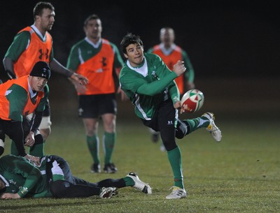 24.02.10 - Wales Rugby Training - Mike Phillips makes a pass during a night training session in preparation for Wales Friday night match against France. 