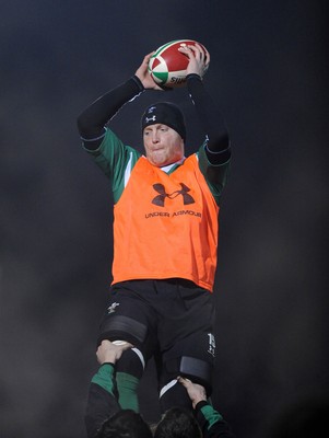 24.02.10 - Wales Rugby Training - Martyn Williams takes line-out ball during a night training session in preparation for Wales Friday night match against France. 