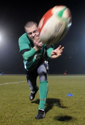 24.02.10 - Wales Rugby Training - Richie Rees gets the ball away during a night training session in preparation for Wales Friday night match against France. 