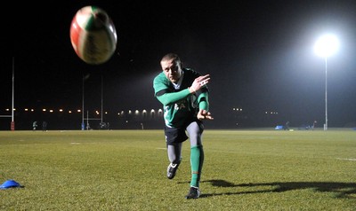 24.02.10 - Wales Rugby Training - Richie Rees gets the ball away during a night training session in preparation for Wales Friday night match against France. 