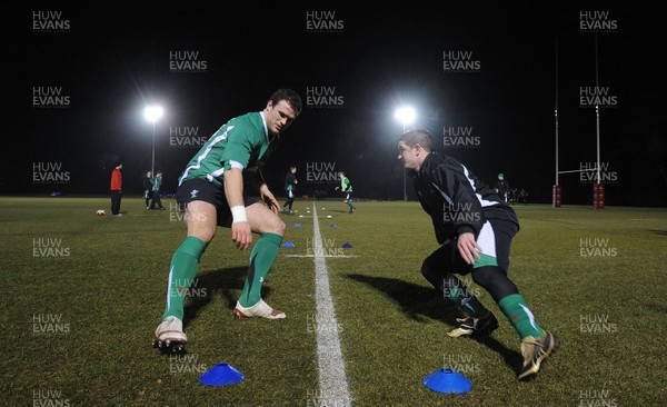24.02.10 - Wales Rugby Training - Jamie Roberts and Shane Williams in action during a night training session in preparation for Wales Friday night match against France. 