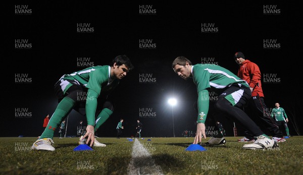 24.02.10 - Wales Rugby Training - Mike Phillips and Andrew Bishop in action during a night training session in preparation for Wales Friday night match against France. 