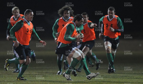 24.02.10 - Wales Rugby Training - Jonathan Thomas in action during a night training session in preparation for Wales Friday night match against France. 