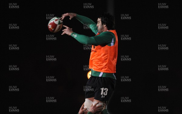 24.02.10 - Wales Rugby Training - Jonathan Thomas takes line-out ball during a night training session in preparation for Wales Friday night match against France. 