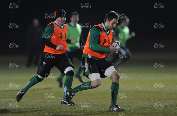 24.02.10 - Wales Rugby Training - Ryan Jones is supported by Martyn Williams during a night training session in preparation for Wales Friday night match against France. 