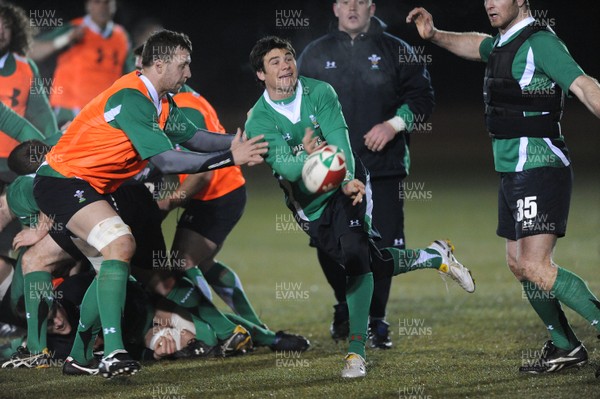 24.02.10 - Wales Rugby Training - Mike Phillips makes a pass during a night training session in preparation for Wales Friday night match against France. 