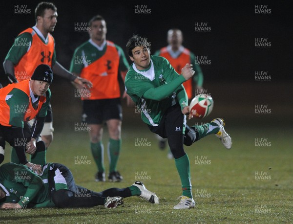 24.02.10 - Wales Rugby Training - Mike Phillips makes a pass during a night training session in preparation for Wales Friday night match against France. 