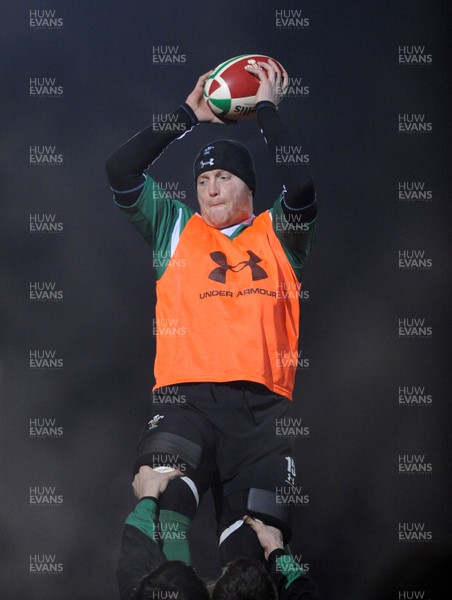 24.02.10 - Wales Rugby Training - Martyn Williams takes line-out ball during a night training session in preparation for Wales Friday night match against France. 
