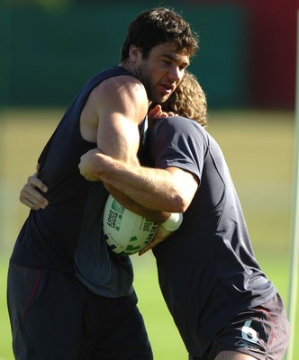 24.09.07 - Wales Rugby World Cup Training - Mike Phillips is tackled by Jamie Robinson during training 
