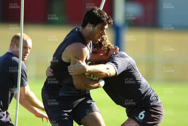 24.09.07 - Wales Rugby World Cup Training - Mike Phillips is tackled by Jamie Robinson during training 