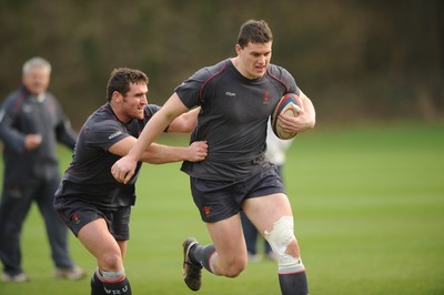 25.01.08 - Wales Rugby Training- Ian Evans is tackled by Huw Bennett 