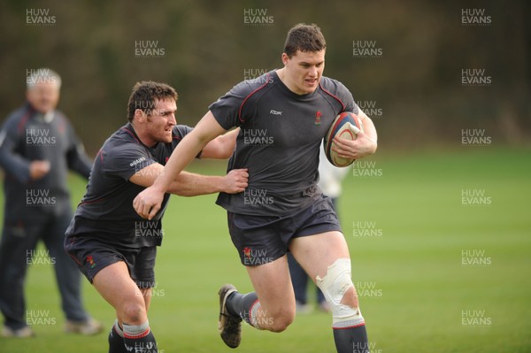 25.01.08 - Wales Rugby Training- Ian Evans is tackled by Huw Bennett 
