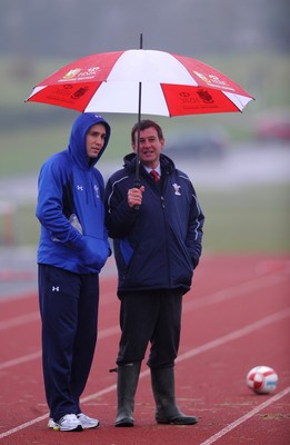 25.01.11 - Wales Rugby Training - Stephen Jones looks on with WRU Chief Executive Roger Lewis during training. 
