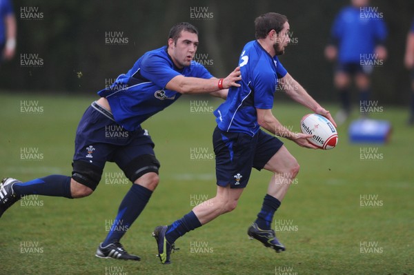 25.01.11 - Wales Rugby Training - Shane Williams is tackled by Josh Turnbull during training. 