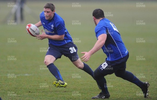 25.01.11 - Wales Rugby Training - Rhys Priestland takes on Ryan Bevington during training. 