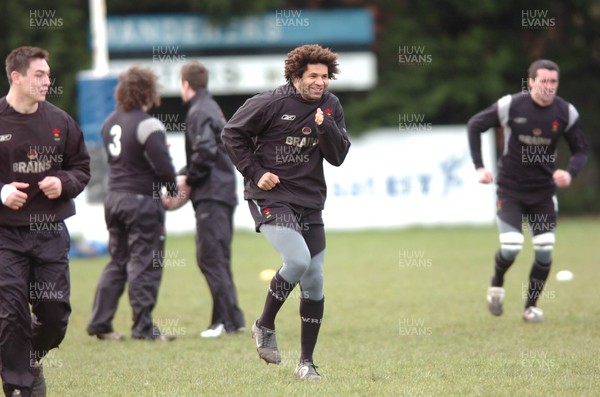 250206  Wales rugby training, Wanderers ground, Dublin Colin Charvis smiles while keeping warm during training     