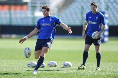 24.02.11 - Wales Rugby Training - James Hook kicks as Stephen Jones looks on during training. 
