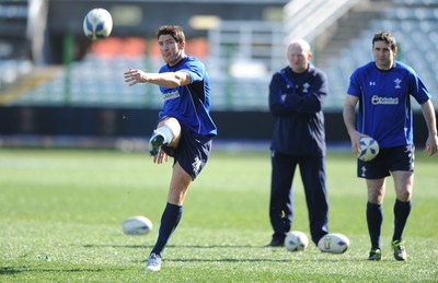24.02.11 - Wales Rugby Training - James Hook kicks as Stephen Jones looks on during training. 