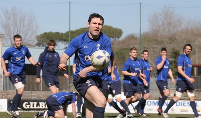 25.02.11 Wales Team Training, Italy. Stephen Jones passes as the Wales Team train on the outskirts of Rome. 