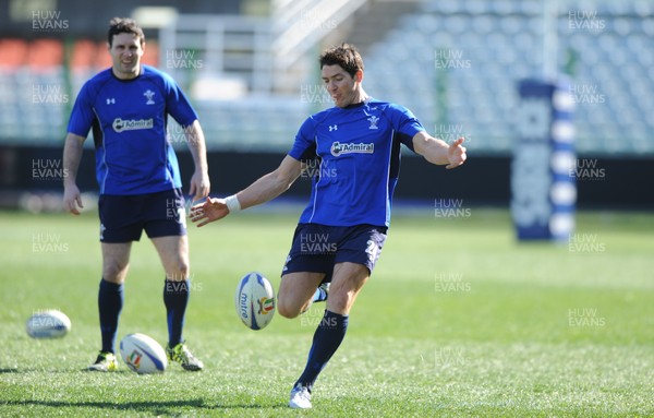 24.02.11 - Wales Rugby Training - James Hook kicks as Stephen Jones looks on during training. 