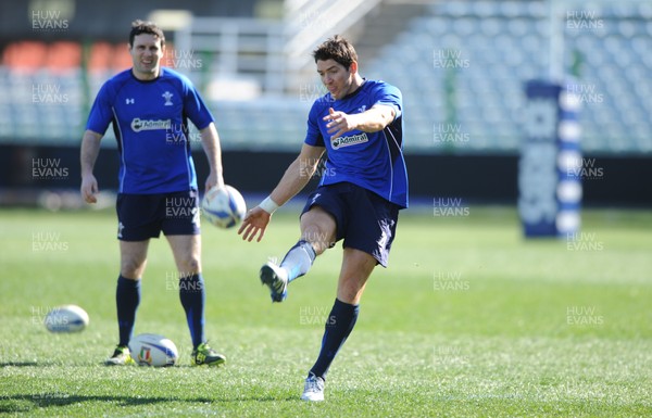 24.02.11 - Wales Rugby Training - James Hook kicks as Stephen Jones looks on during training. 