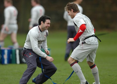260107 - Wales Rugby Training - Gavin Evans(R) and Stephen Jones go through a move during training 