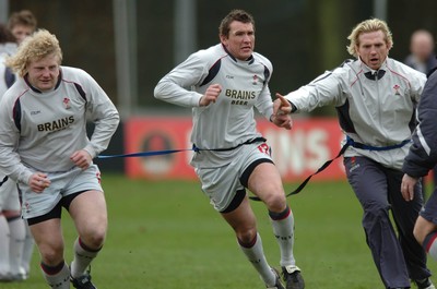 260107 - Wales Rugby Training - Duncan Jones, Scott Morgan and Alix Popham go through a move during training 