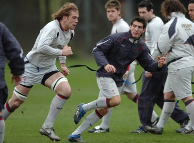 260107 - Wales Rugby Training - James Hook(R) and Alun Wyn Jones go through a move during training 