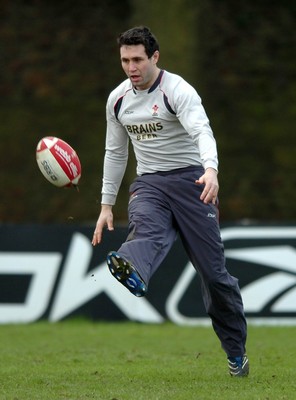 260107 - Wales Rugby Training - Stephen Jones kicks ahead during training 