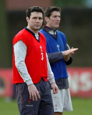 260107 - Wales Rugby Training - Stephen Jones(L) and James Hook look on during training 