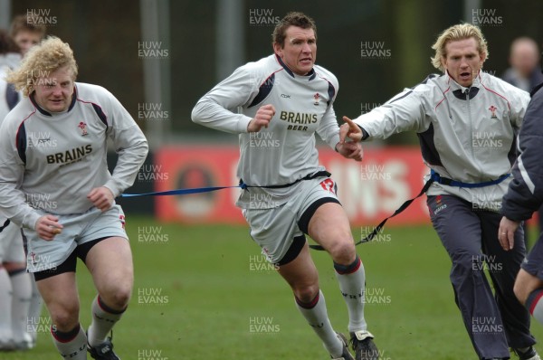 260107 - Wales Rugby Training - Duncan Jones, Scott Morgan and Alix Popham go through a move during training 