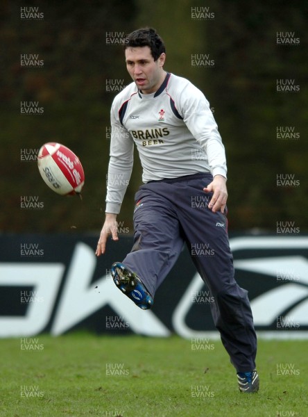 260107 - Wales Rugby Training - Stephen Jones kicks ahead during training 