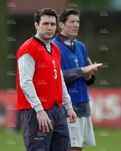 260107 - Wales Rugby Training - Stephen Jones(L) and James Hook look on during training 