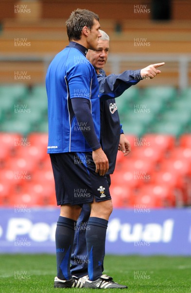 26.11.10 - Wales Rugby Training - Head coach Warren Gatland talks to Tom James during training. 