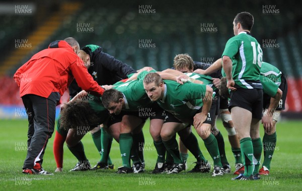 27.11.08 - Wales Rugby Training - Adam Jones, Matthew Rees and Gethin Jenkins pack down during training. 