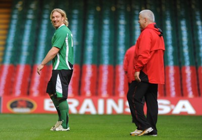 27.11.09 - Wales Rugby Training - Andy Powell during training as head coach Warren Gatland looks on. 