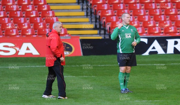 27.11.09 - Wales Rugby Training - Head coach Warren Gatland talks to new captain Gethin Jenkins during training. 