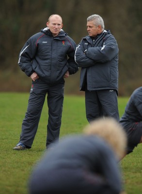 28.01.08 - Wales Rugby Training - Wales Kicking Coach, Neil Jenkins looks on during training with Head Coach, Warren Gatland(R) 