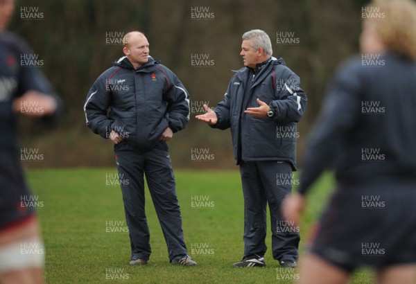28.01.08 - Wales Rugby Training - Wales Kicking Coach, Neil Jenkins looks on during training with Head Coach, Warren Gatland(R) 