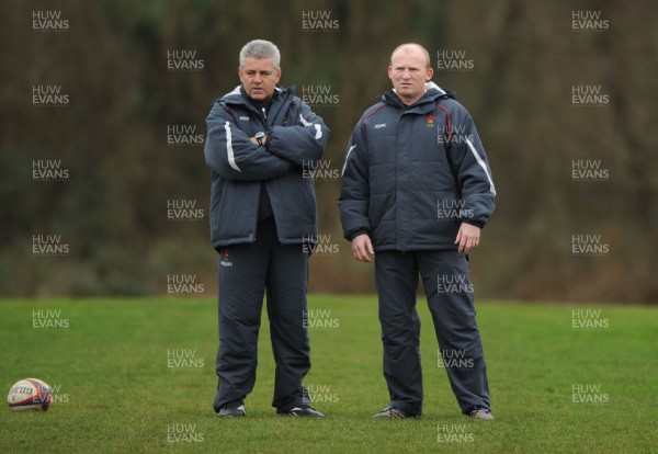 28.01.08 - Wales Rugby Training - Wales Kicking Coach, Neil Jenkins looks on during training with Head Coach, Warren Gatland(L) 