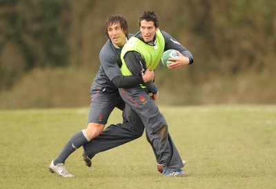 28.02.08 - Wales Rugby Training - James Hook is tackled by Gavin Henson during training 