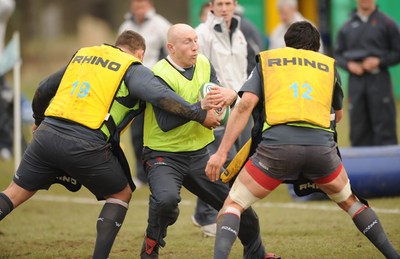 28.02.08 - Wales Rugby Training - Tom Shanklin is tackled by Rhys Thomas(L) and Jonathan Thomas during training 