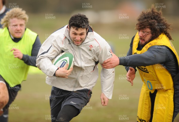 28.02.08 - Wales Rugby Training - Stephen Jones gets past Adam Jones(R) during training 