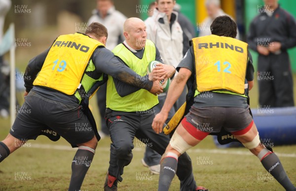 28.02.08 - Wales Rugby Training - Tom Shanklin is tackled by Rhys Thomas(L) and Jonathan Thomas during training 