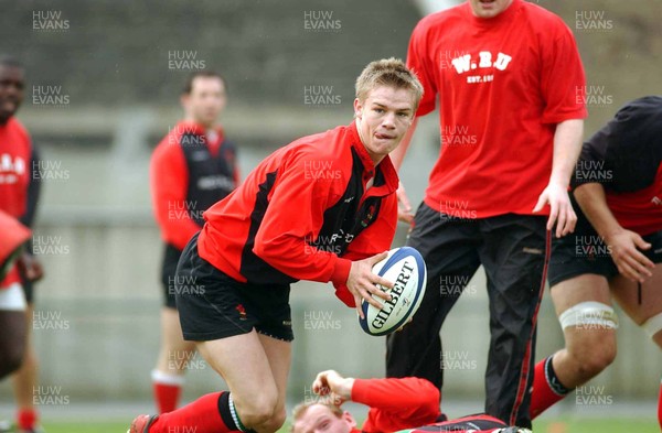 280303 - Wales Rugby Training - Wales scrum-half Dwayne Peel gets the backs moving during training