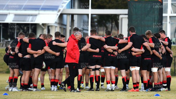 280622 - Wales Rugby Training - Wayne Pivac walks past a players huddle during training