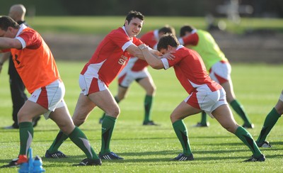 28.10.09 - Wales Rugby Training - Stephen Jones warms up during training. 